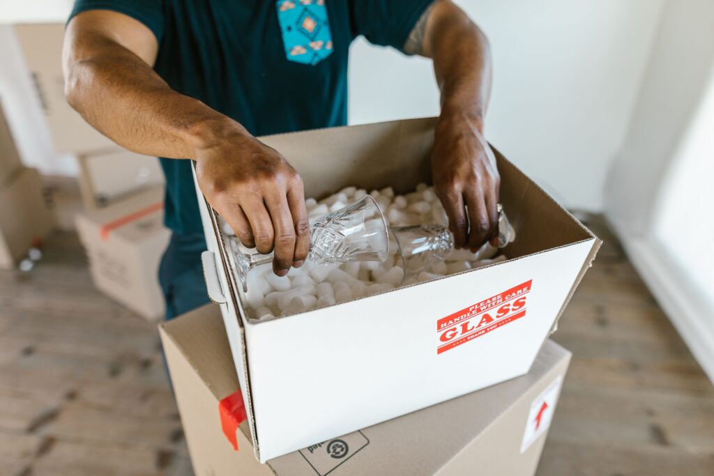 a man putting glasses on the box